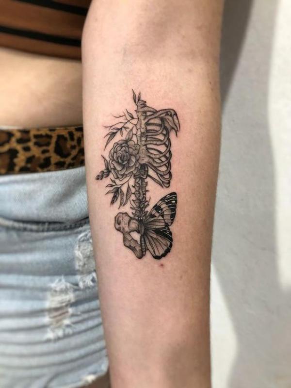 Small skeleton with rose and butterfly