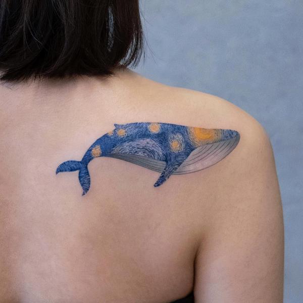 Starry night whale shoulder blade tattoo