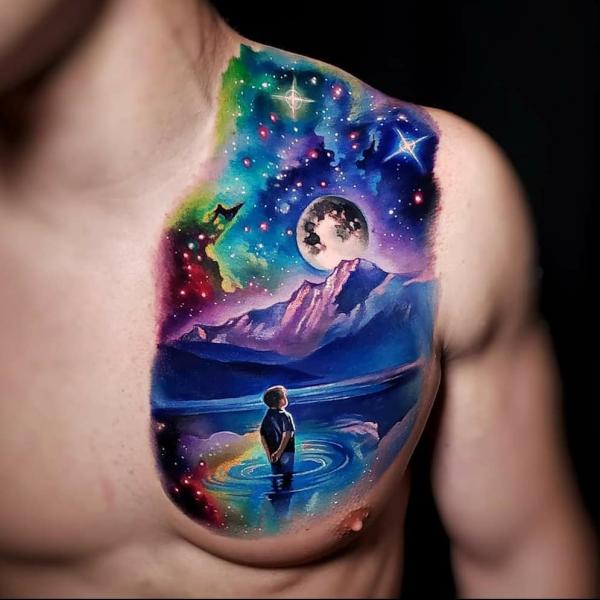 A boy watching galaxy chest tattoo