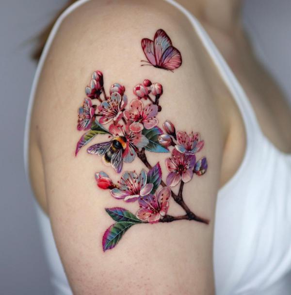 A butterfly flying over cherry blossom