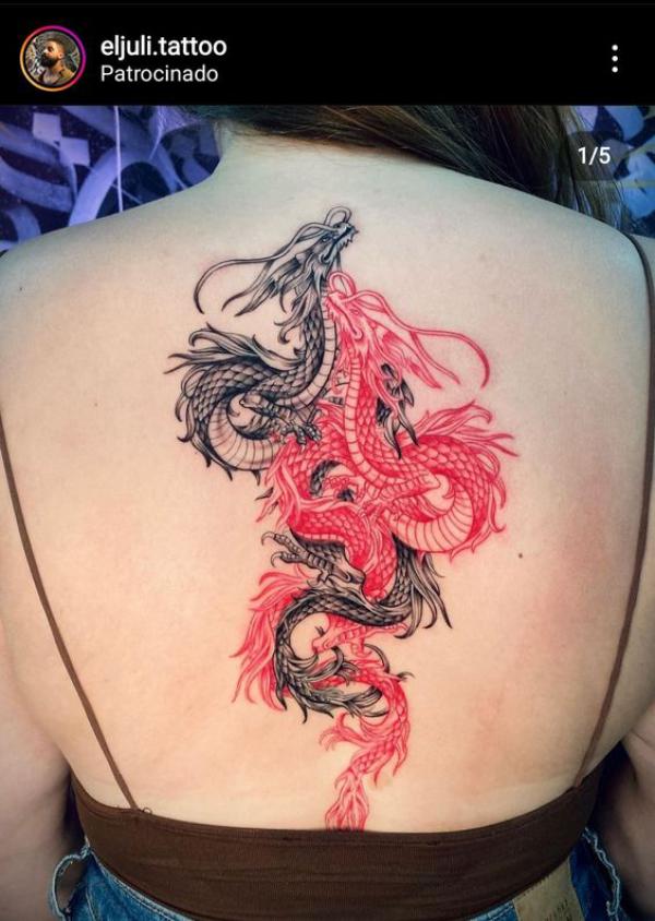 A red dragon and a black and white dragon entangled together