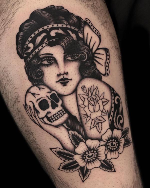 A woman holding a skull