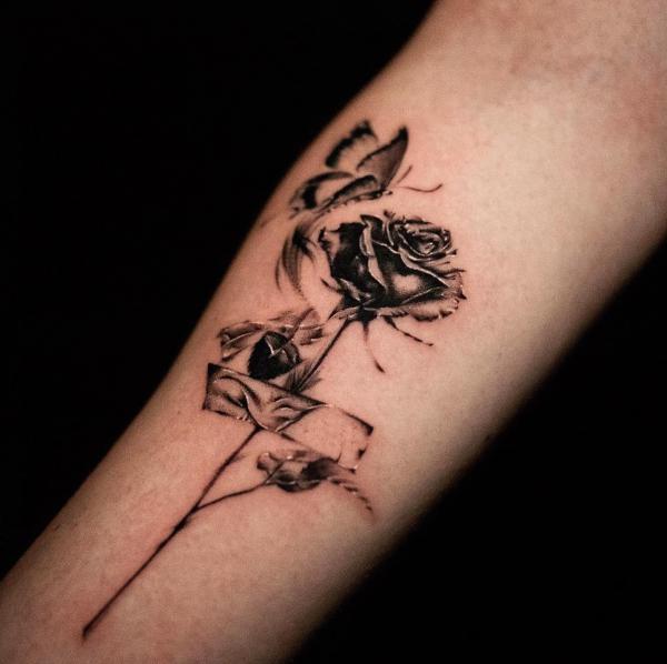 Abstract rose and butterfly dark tattoo