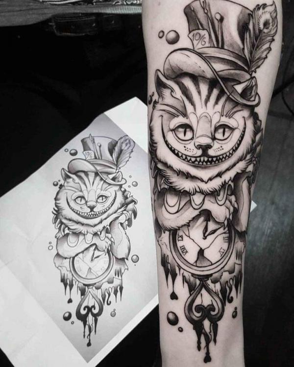 Black and grey Cheshire Cat and clock tattoo forearm