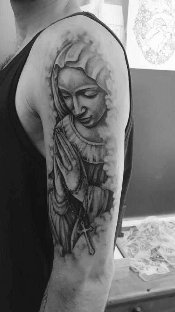 Black and grey Virgin Mary praying hands with rosary beads