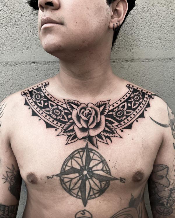 Black and white rose collar tattoo