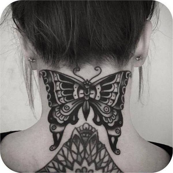 Black and white traditional butterfly tattoo on the back of neck 