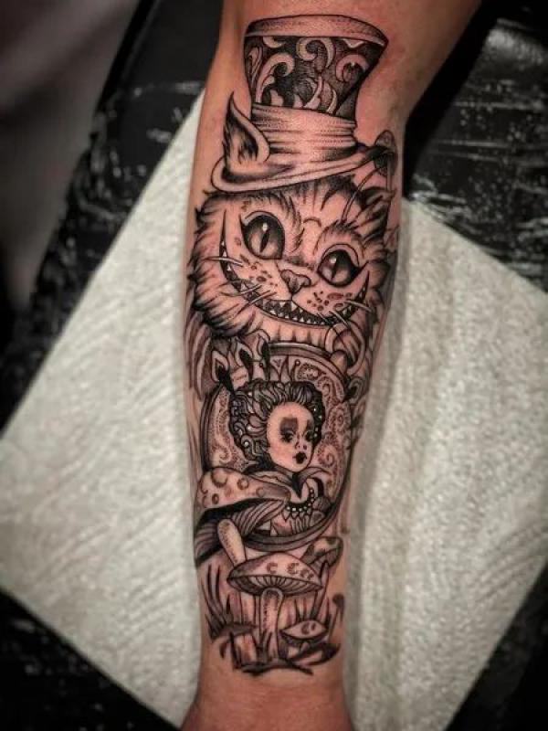 Black and white Queen of Hearts and Cheshire Cat tattoo