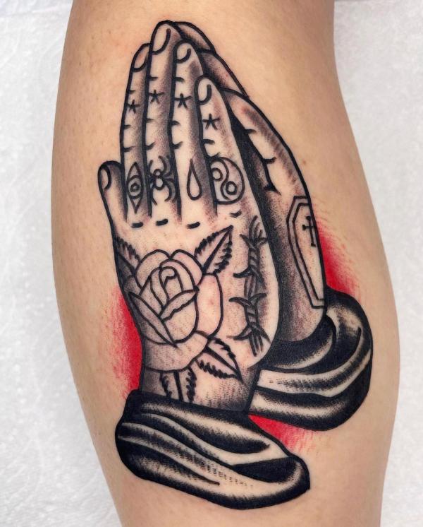 Black and white traditional praying hands tattoo