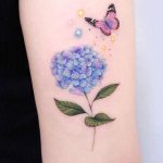 Blue hydrangea and butterfly with stars tattoo