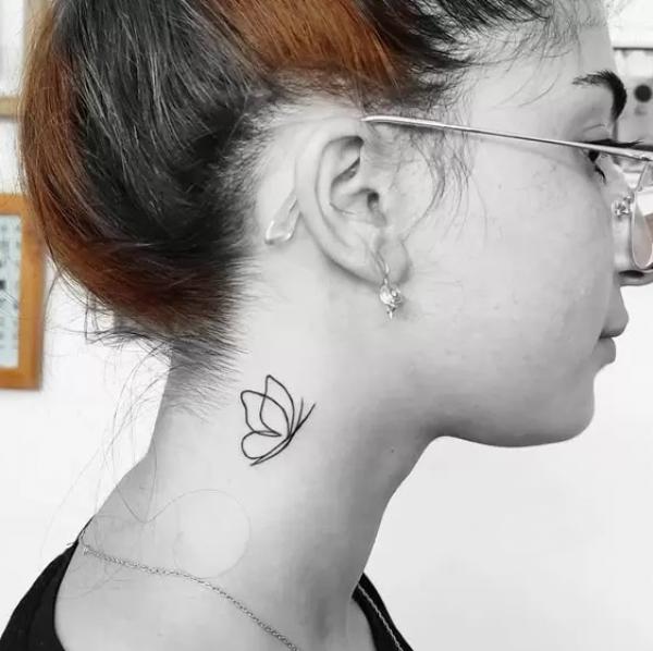 Butterfly outline neck tattoo