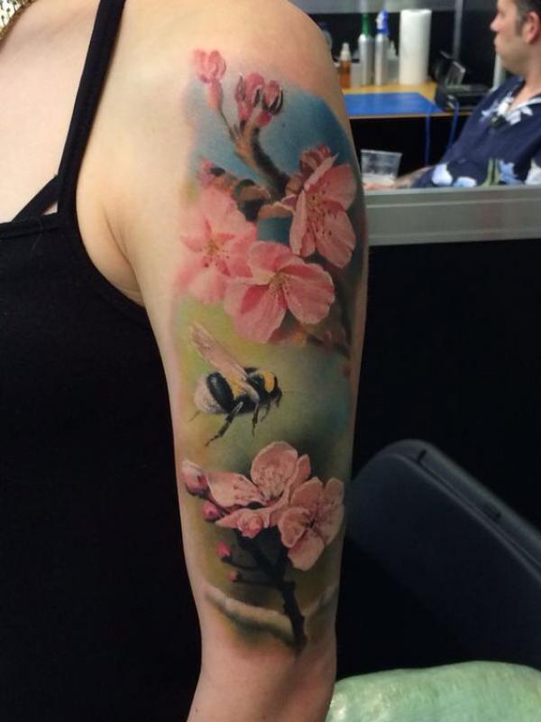 Cherry blossom and bee tattoo