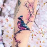 Cherry blossom and galaxy sparrow tattoo