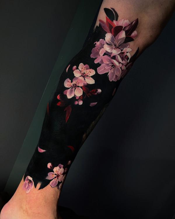 Cherry blossom blackout forearm tattoo