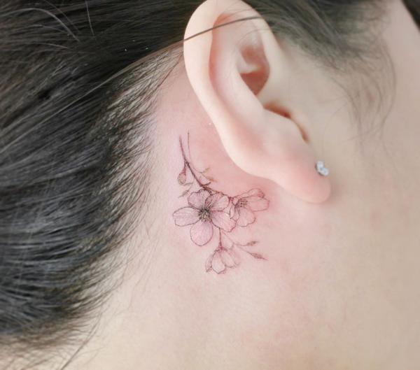 Cherry blossom tattoo behind ear