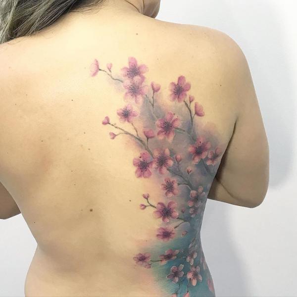 Cherry blossom tattoo on side of back