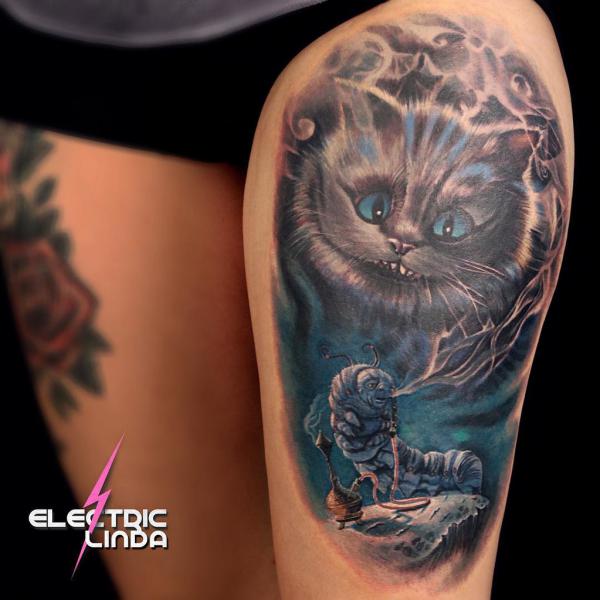 Cheshire Cat and caterpillar thigh tattoo