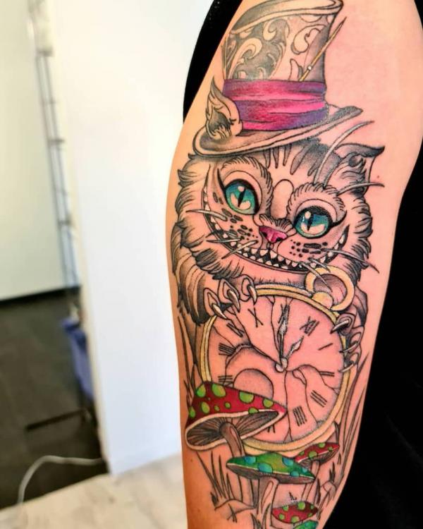 Cheshire Cat and clock with mushroom tattoo