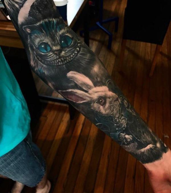 Cheshire Cat and white rabbit blackwork full sleeve tattoo