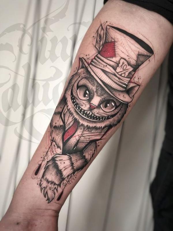 Cheshire Cat forearm tattoo