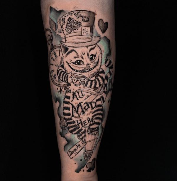 Cheshire Cat holding a cup with words Were all mad here