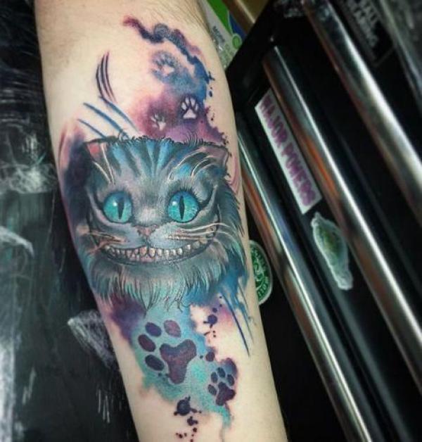 Cheshire Cat with paw print tattoo