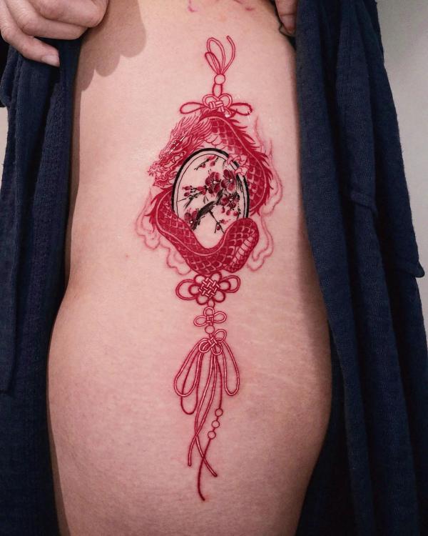 Chinese red dragon tattoo with Plum Blossom and tassel