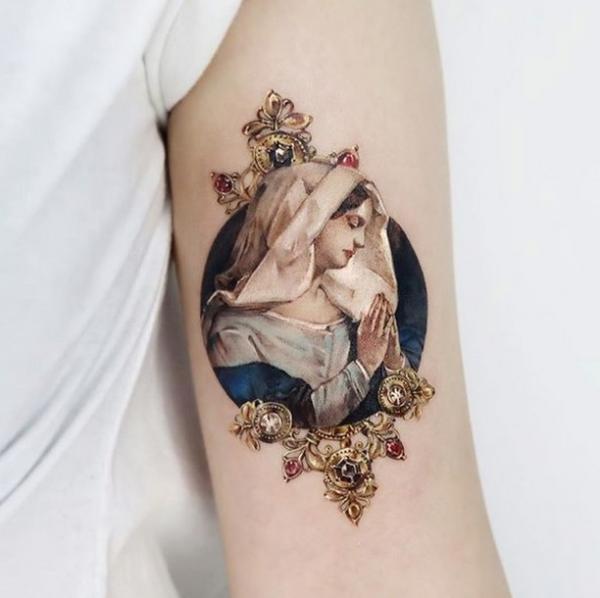 Colored feminine Virgin Mary tattoo