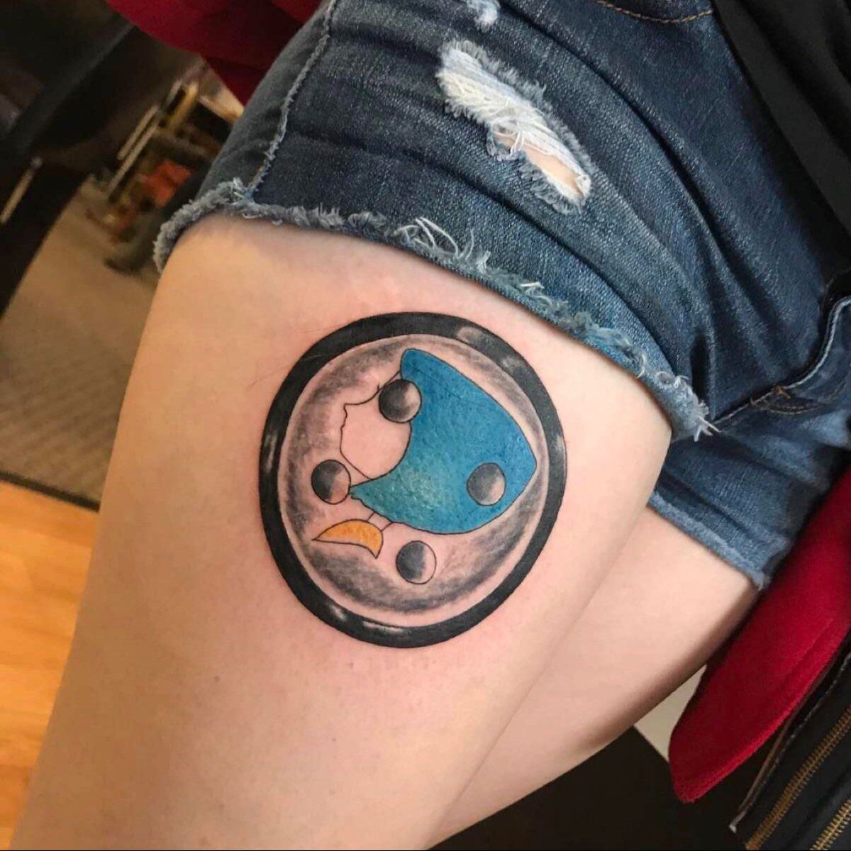 Coraline button thigh tattoo