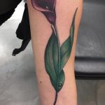Delicate purple calla lily tattoo