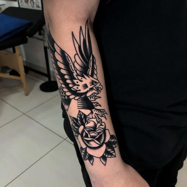 Eagle and rose forearm tattoo