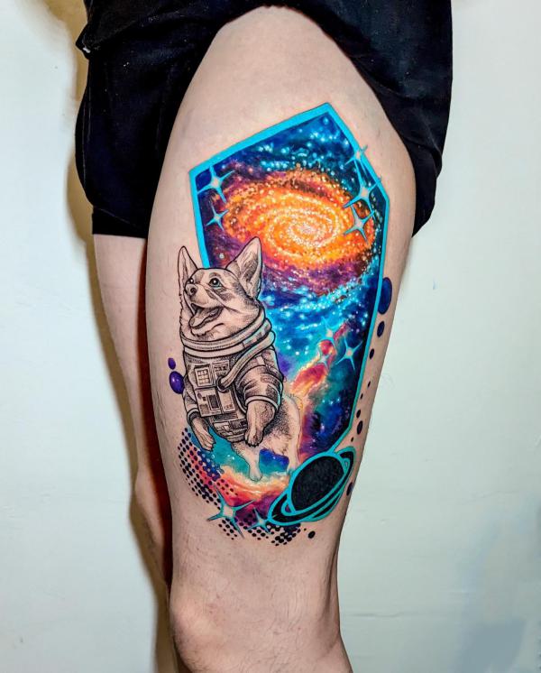 Galaxy and dog astronaut thigh tattoo
