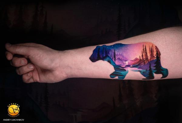 Galaxy and landscape tattoo