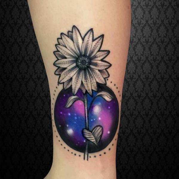 Galaxy ball and black and grey daisy tattoo