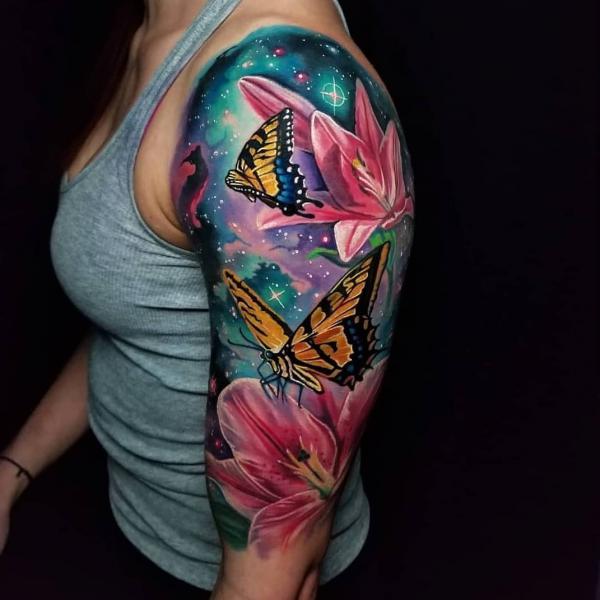 Galaxy with flower and monarch butterfly tattoo