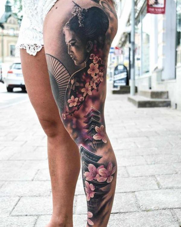Geisha and temple with cherry blossom leg tattoo