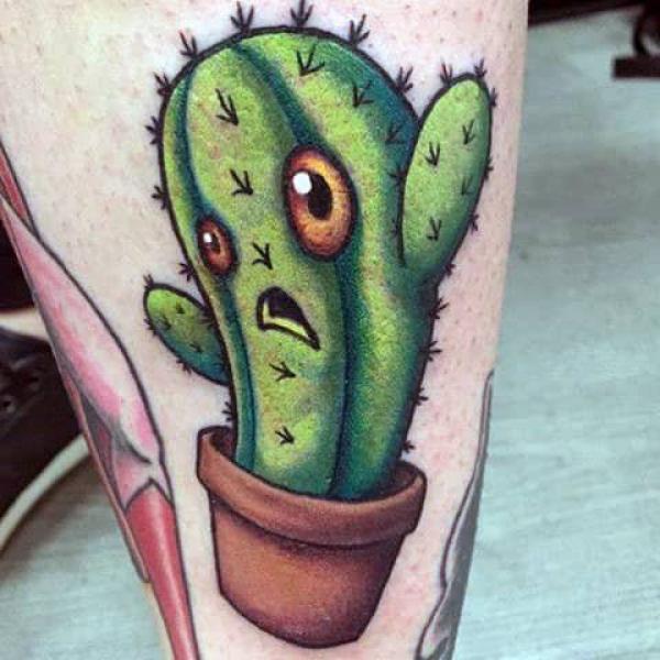 Green cactus with eyes tattoo