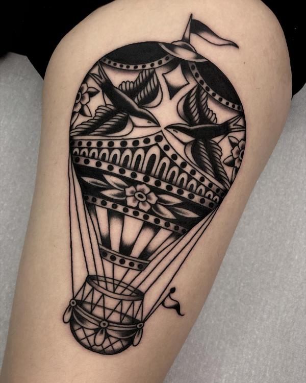 Hot air balloon with a pair of swallows painted on it