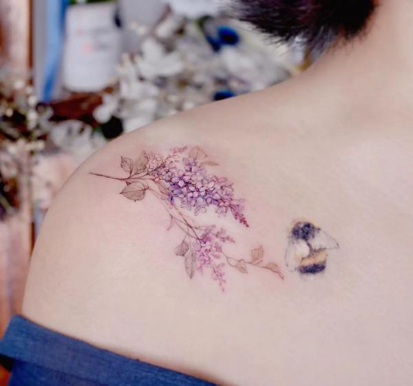 Lilac and bee tattoo