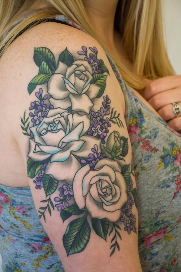 Lilac and negative space roses tattoo