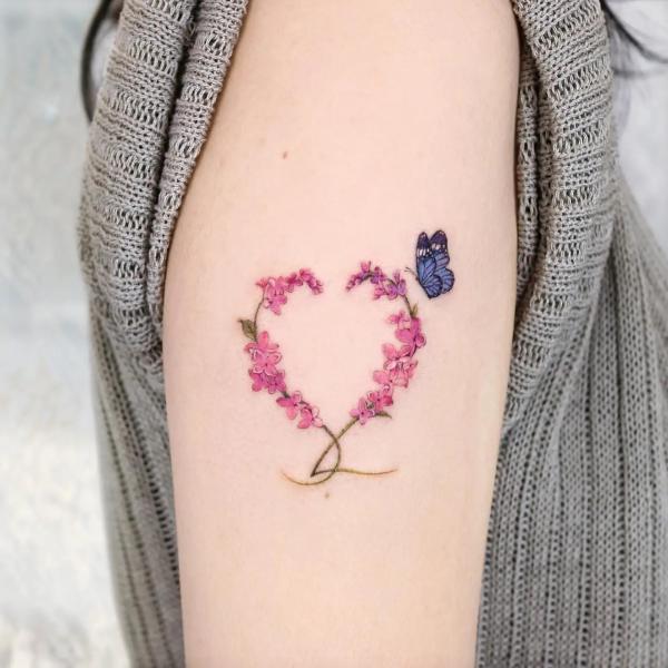 Lilac heart tattoo with butterfly