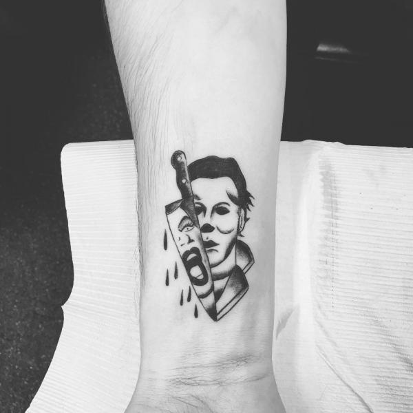 Michael Myers and knife wrist tattoo black and white