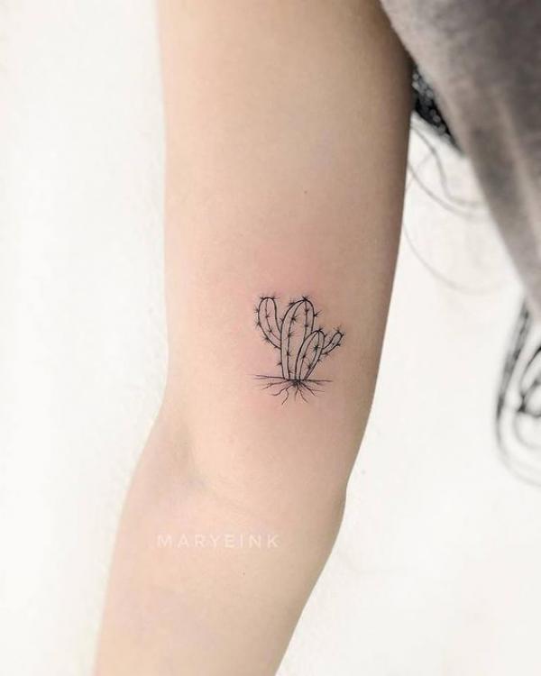 Minimalist catus bicep tattoo