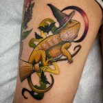 Neo traditional chameleon wearing a magic hat tattoo