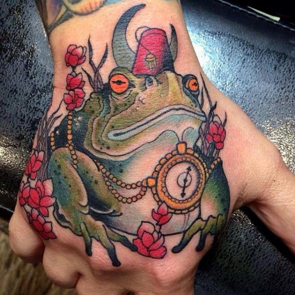 Neo traditional frog hand tattoo