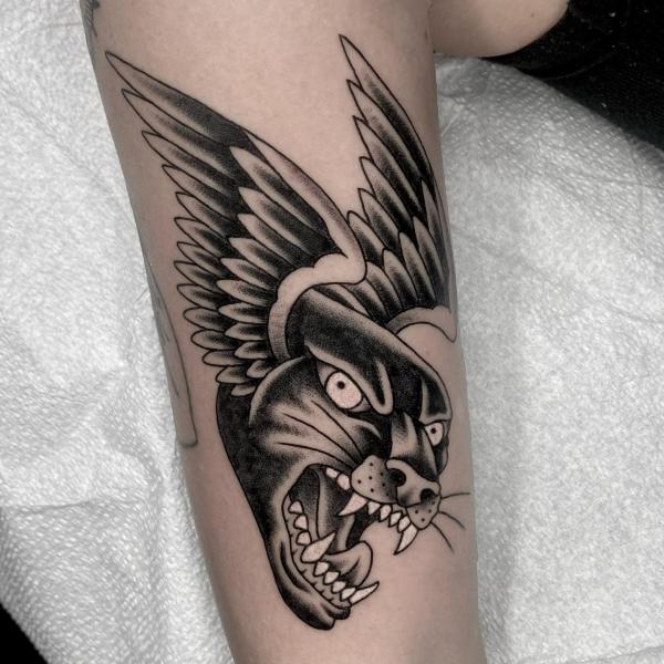 Panther head with wings