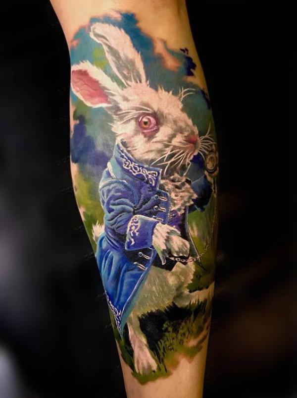 Realistic white rabbit calf tattoo