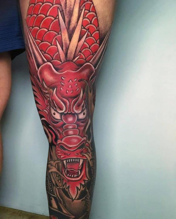 Red Japanese dragon head leg tattoo