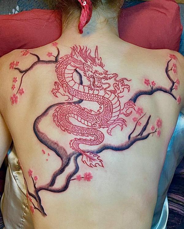 Red dragon and cherry blossom tattoo