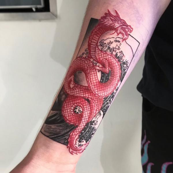 Red dragon and great wave tattoo